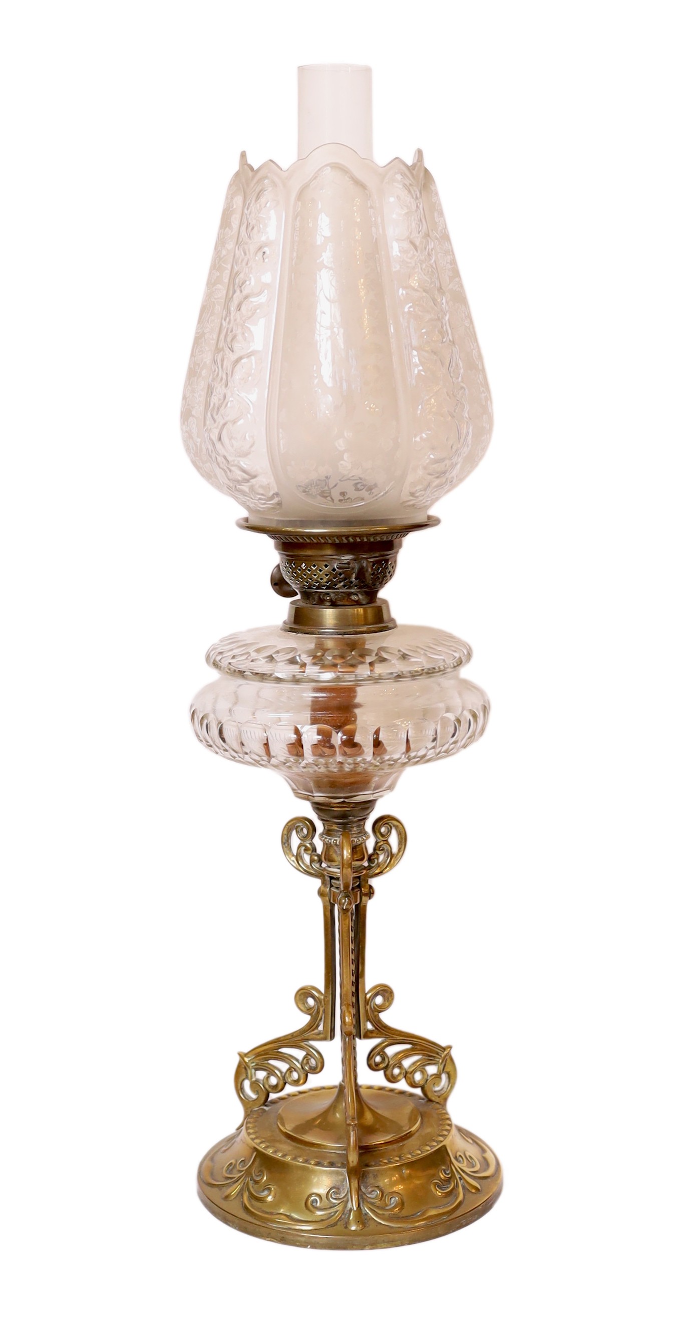 A late Victorian brass and cut glass oil lamp with duplex mechanism and frosted glass shade, height overall 65cm
